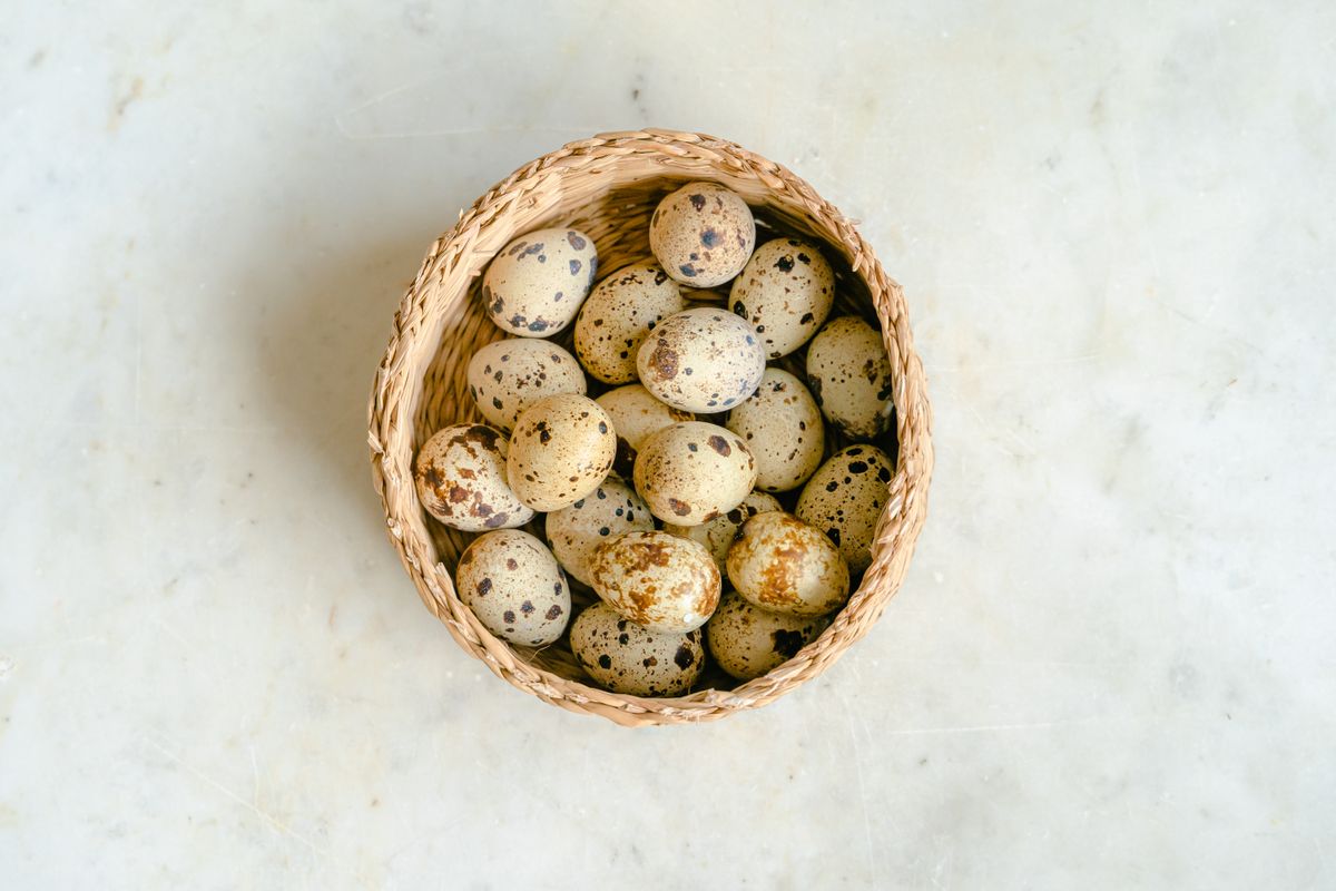 A basket of quail eggs seen from above