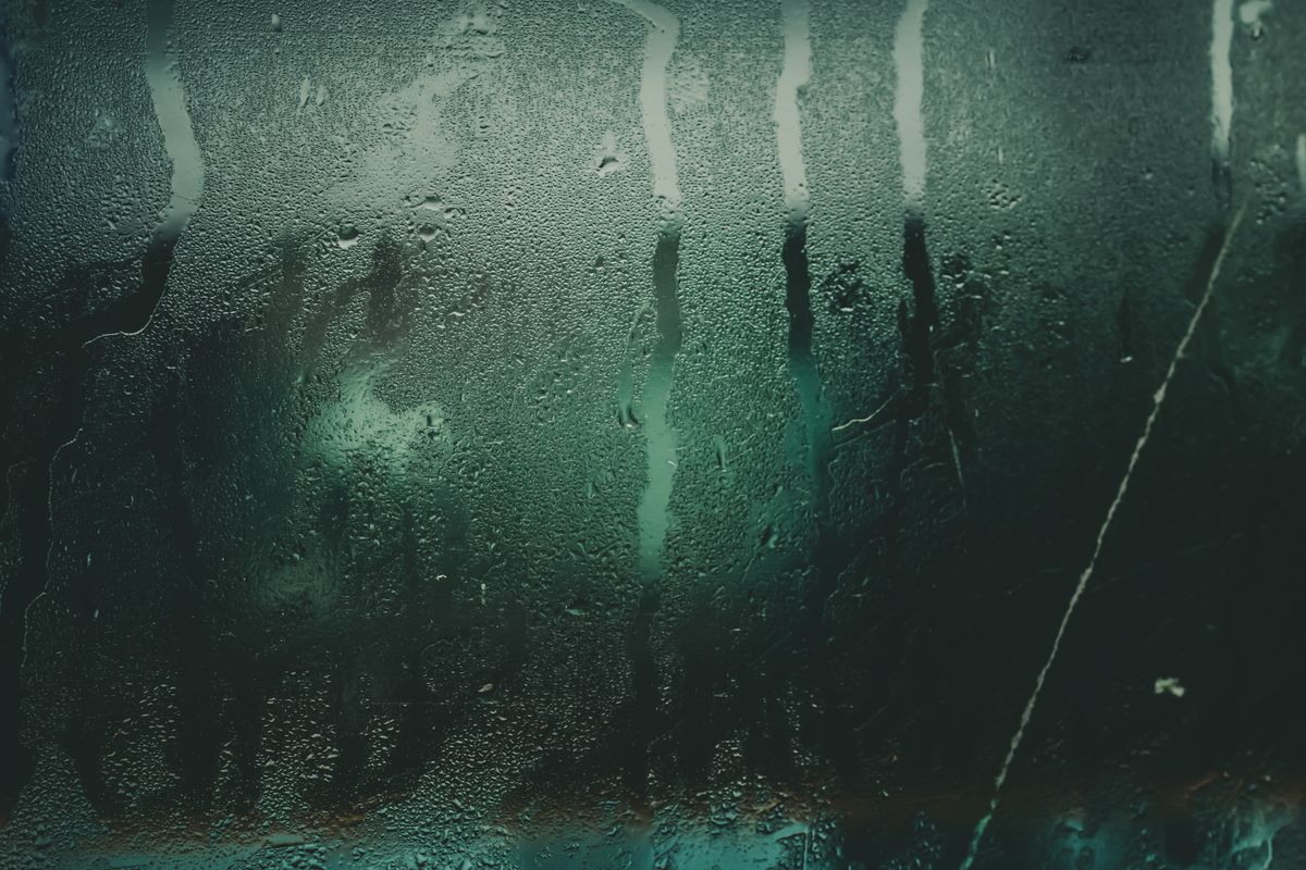 Water droplets on a fogged glass surface
