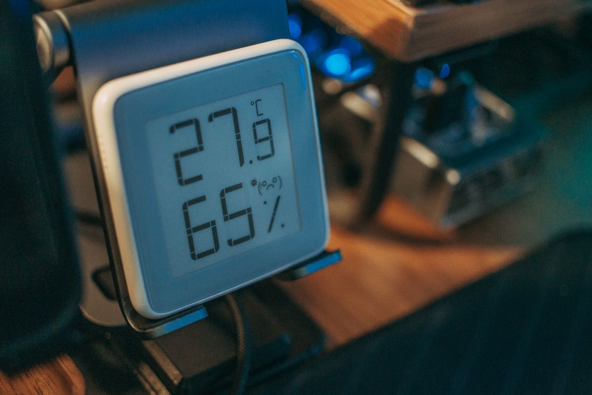 A digital display showing temperature and humidity